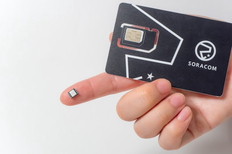 Soracom eSIM, with standard SIM card for scale