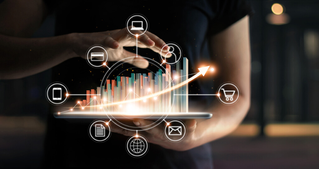 Business people holding tablet and graph chart statics growing in e-commerce global market and icon customer network connection on virtual interface. Arrow graph corporate future growth plan. Digital Online Marketing. Business ecommerce  technology. Image by Adobe Stock