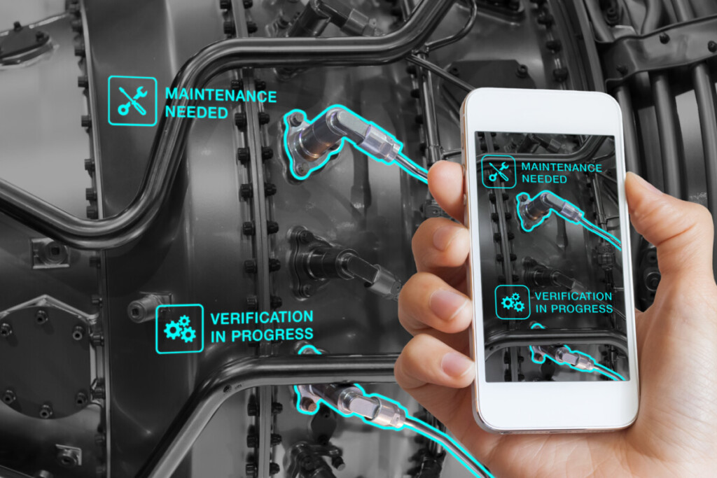 Augmented Reality technology maintenance and service of mechanical parts, technician using smartphone with AR interface on screen in smart industry, automated monitoring process, predictive maintenance